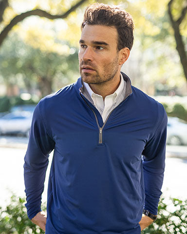 man wearing blue pullover ready for sport event