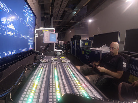 Tim Brennan sitting in front of a Sony MVS 6000 Vision mixing desk on Rhianna's Diamonds tour