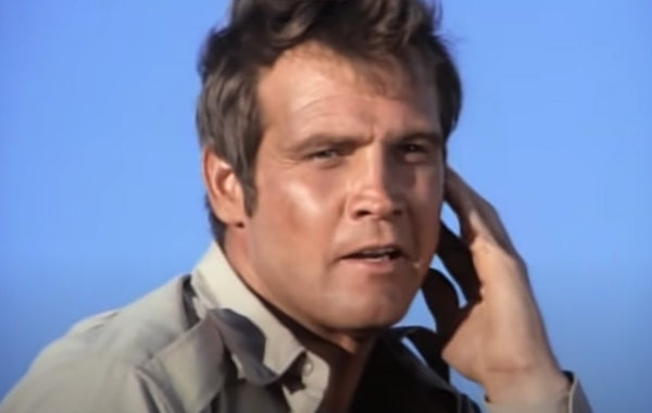 Still Of Lee Majors with a hand to his ear in The Six Million Dollar Man episode Population: Zero