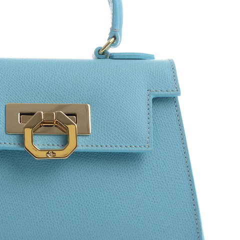 A sky-blue leather Carbotti handbag - right upper part only visible