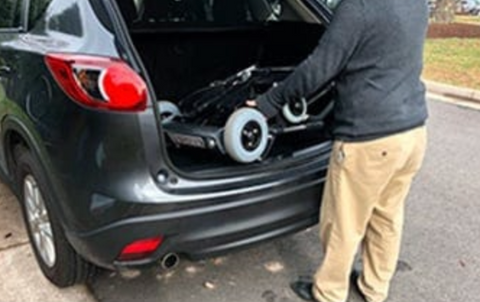 Power chair folded up in the trunk