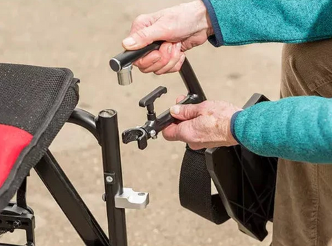 Women adding leg rest to wheelchair