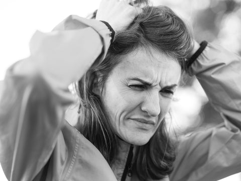 women upset and scrunching her hair