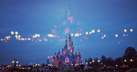 Disneyland castle at night with sparkling lights