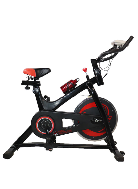 Marshal Fitness Indoor Exercise Spinning Bike Cycling Spine Bike Cardio Workout Driven Flywheel Cycling Adjustable Handlebars Seat Resistance Digital Monitor