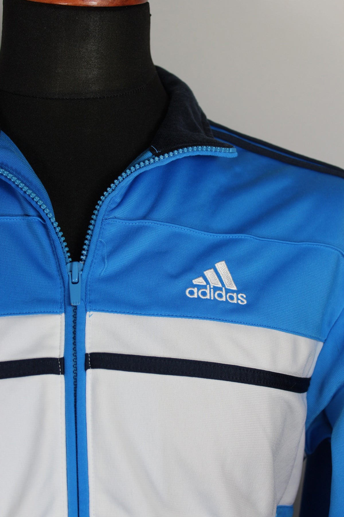 blue and white adidas track jacket