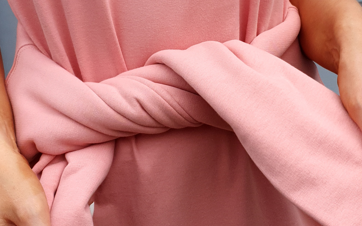 The perfect shade of pink. Canyon Pink hoodie and dress close up