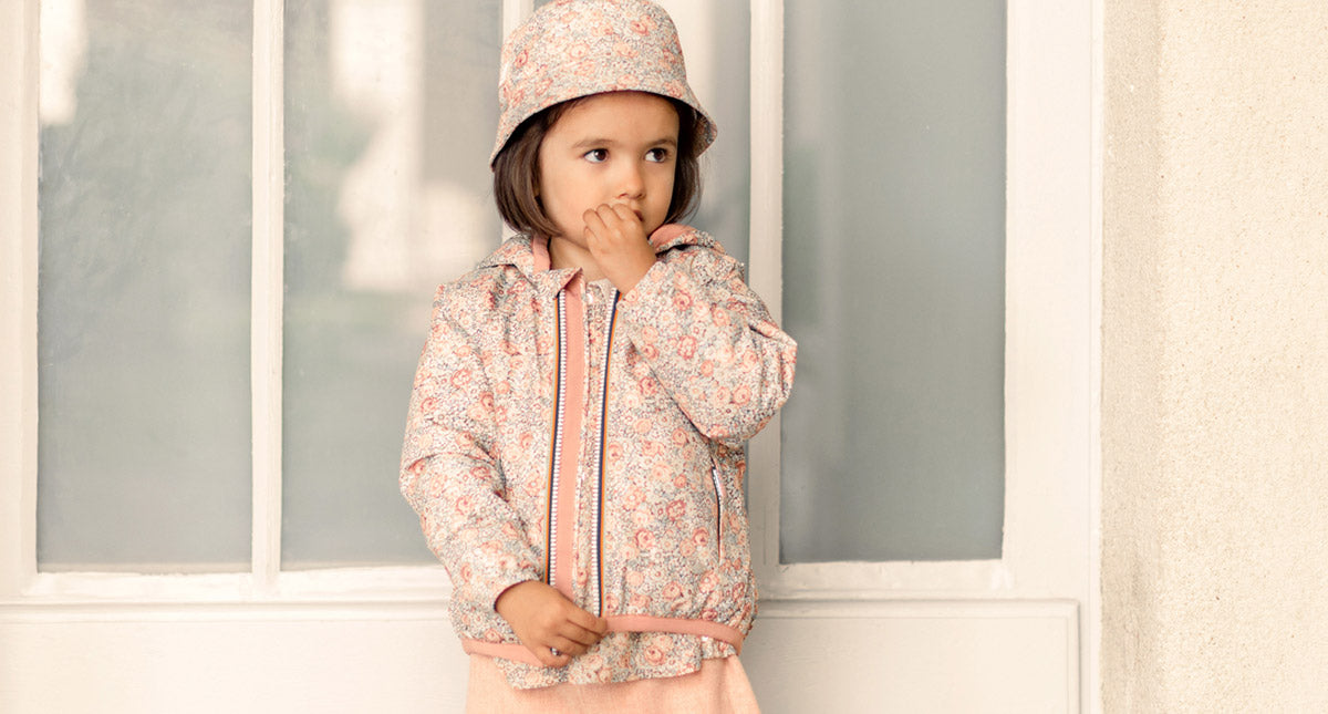The emblematic windbreaker K-Way® for Child in a Print Exclusive floral with frosted and winter colors.
