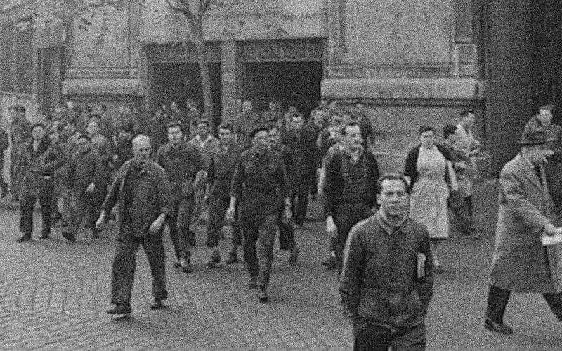 The French workers left the scene, wearing their work jackets.