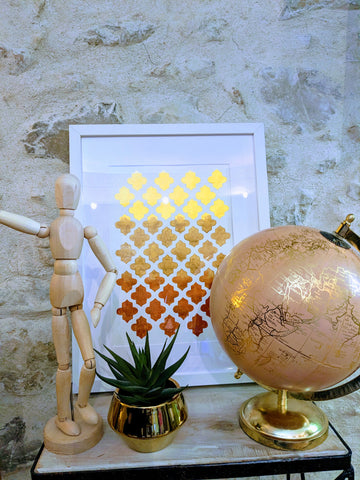 Moroccan patterned watercolor in bronze and golds completed travel inspired decor with a world globe