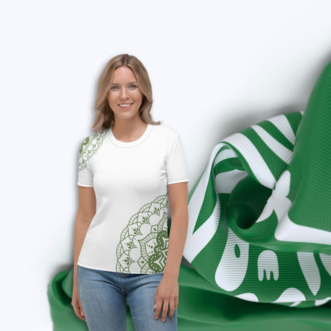 white mandala tshirt with green mandala in an all over print design standing in front of the saudi arabian flag