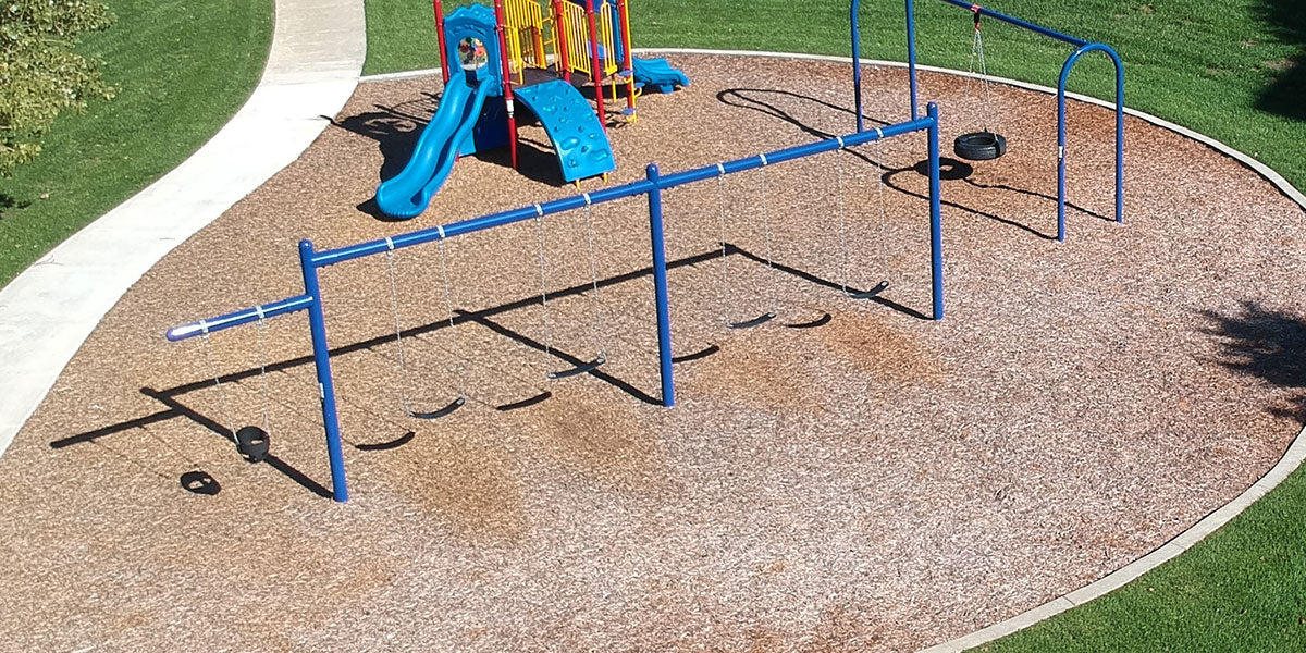 Swings for industrial playground equipment