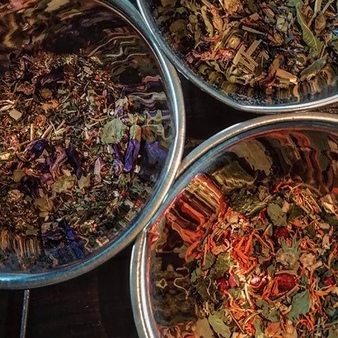 Dried herbs being prepared for tincture