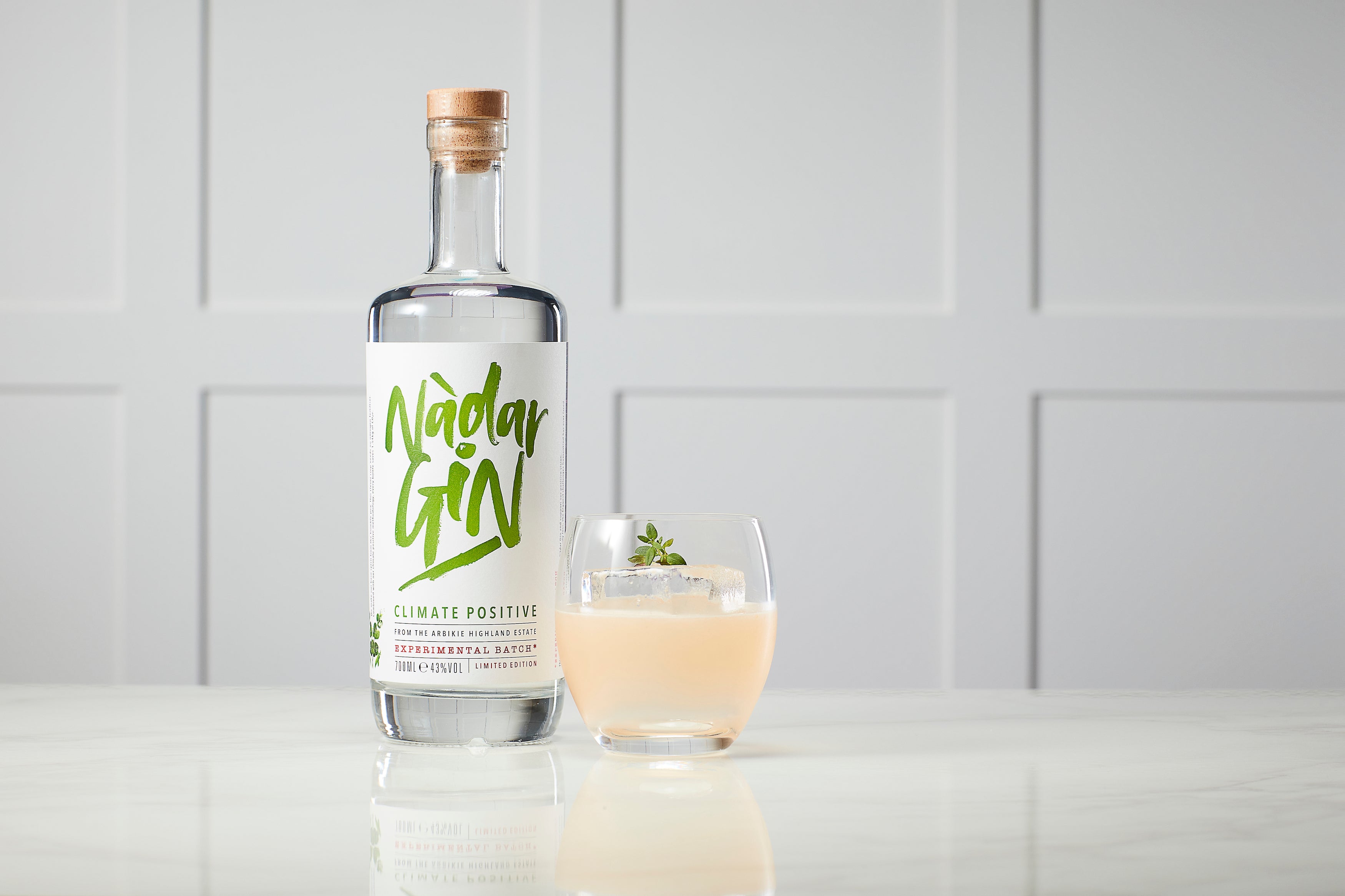 nàdar gin bottle with perfect climate cocktail
