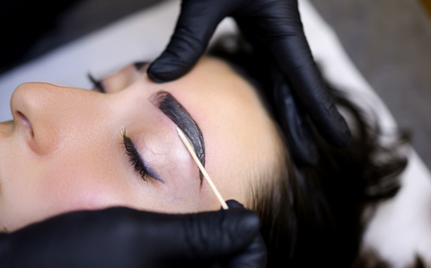 Eyebrow training online technician tinting eyebrows.