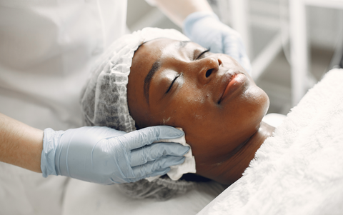 Woman receiving facial course training