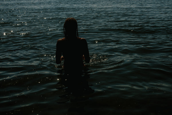 woman standing in water - feel the water around you