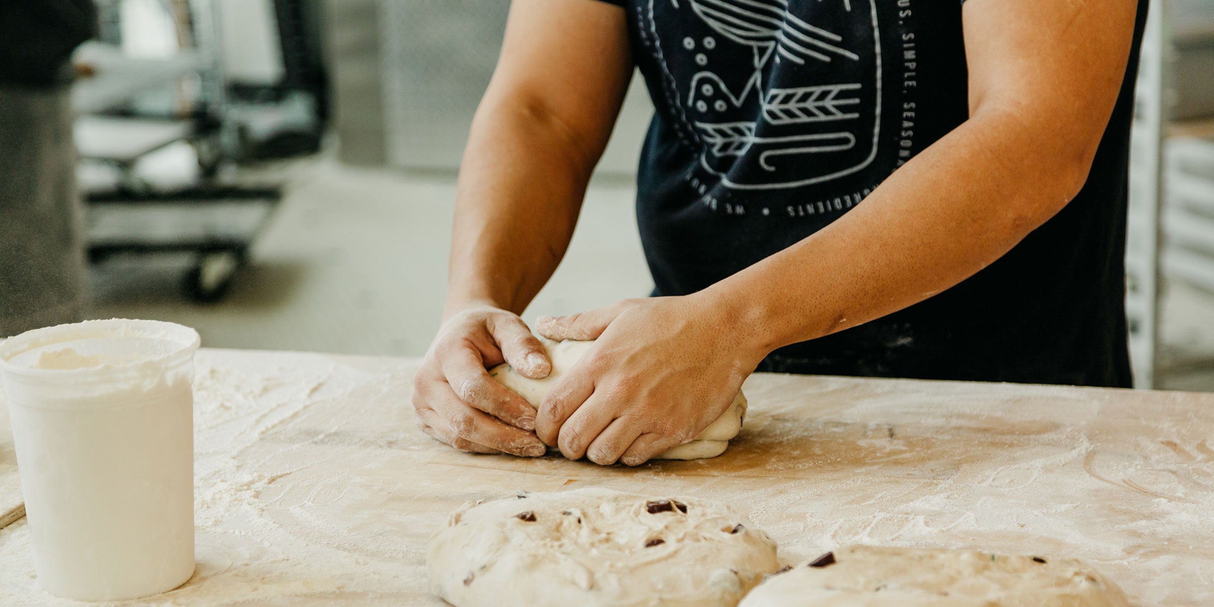 Close up of hands kneading dough