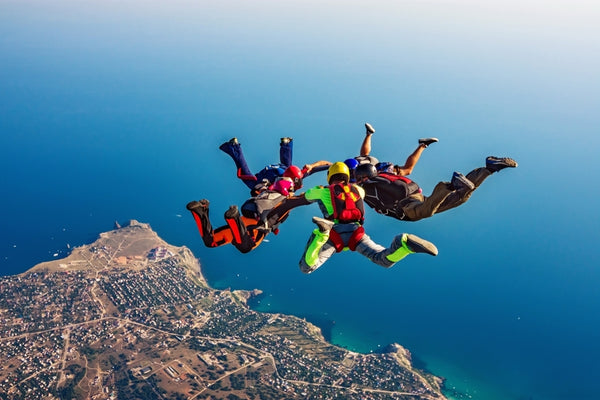 group skydiving over the ocean for a 30th birthday idea