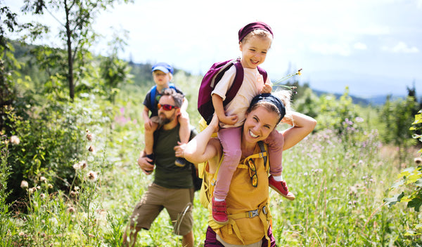 Woman hiking with husband and kids to celebrate Mother’s Day