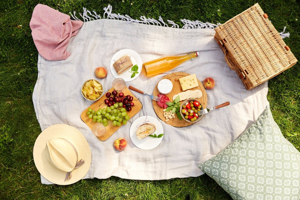 Delicious picnic food ideas  spread on a cozy blanket