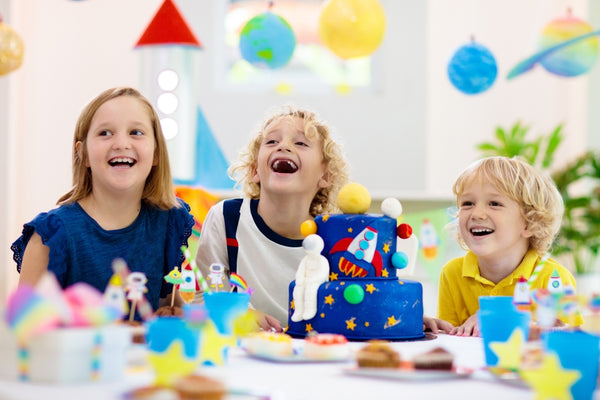 Little kids celebrating at themed birthday party