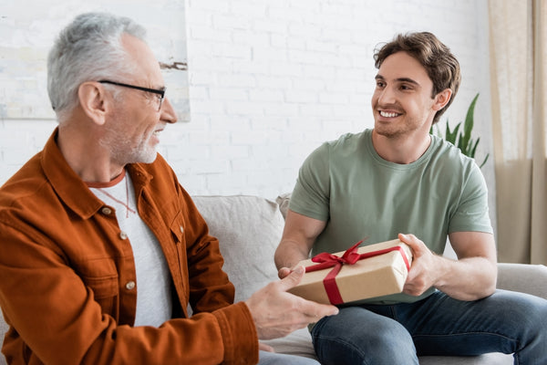 Man surprising dad with a Father’s Day gift