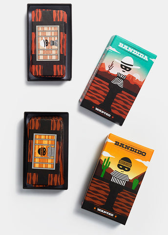 Bandido and Bandida game box tops next to open boxes with cards inside