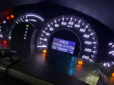 Check hybrid system dash warning light on hybrid electric vehicle