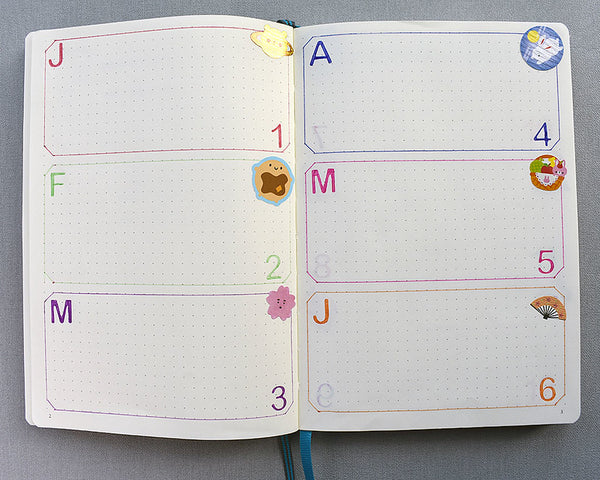 Notebook with month stickers