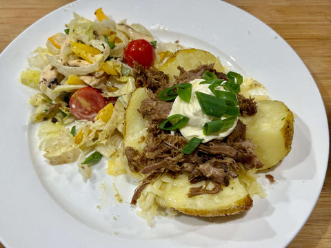 Pulled Lamb Backed Potato with Cowboy Butter