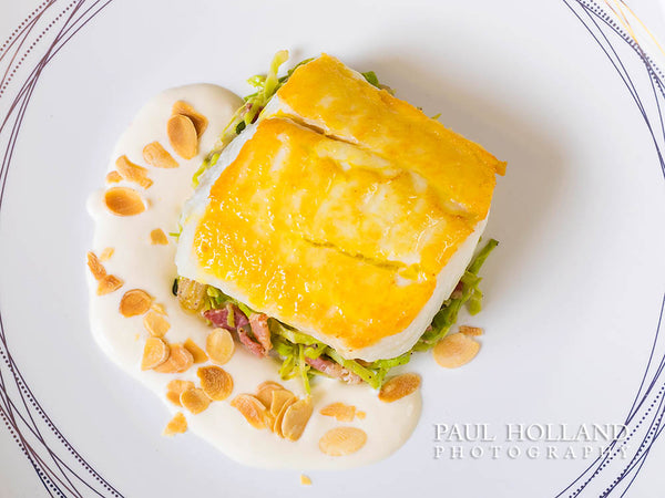 Image of a pan-fried halibut dish photographed by Paul Holland