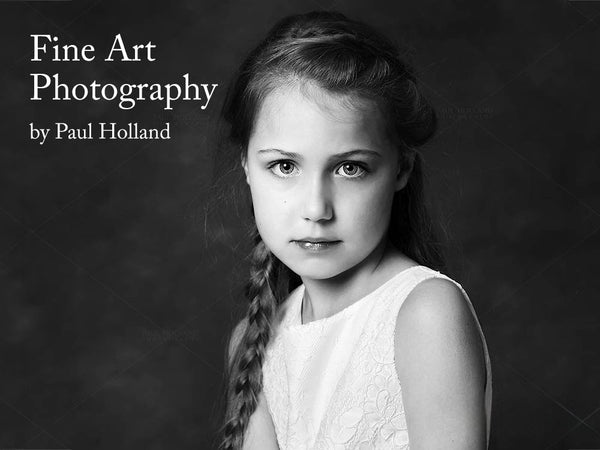 A black and white fine art photograph of a young girl