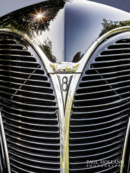 Image showing the symmetry of Ford V8 grille and bright chrome in a V shape