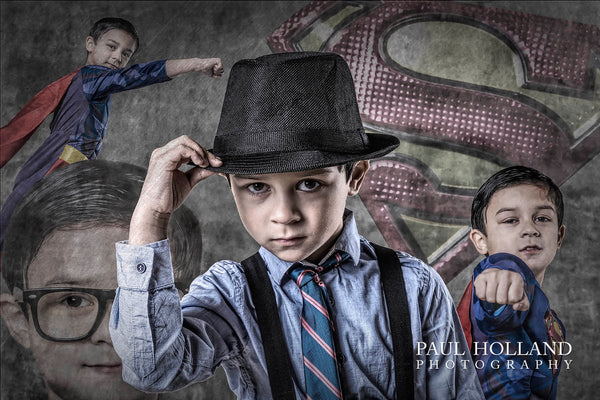 Photo of a young boy dressed as Clark Kent and Superman