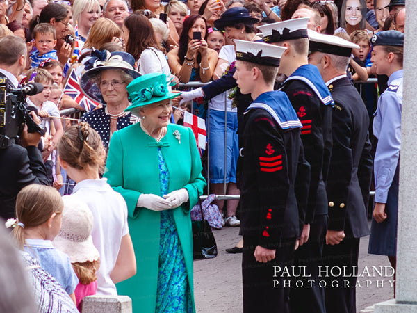 Queen Elizabeth II talking to Sea Cadets and local school children
