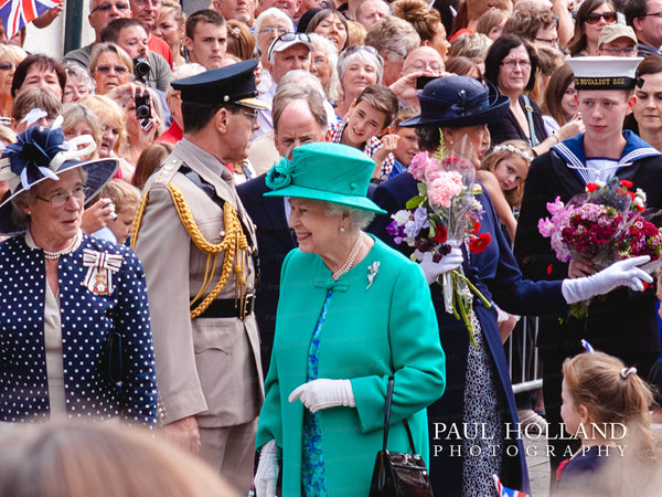 Queen Elizabeth smiling at onlookers in the crowd