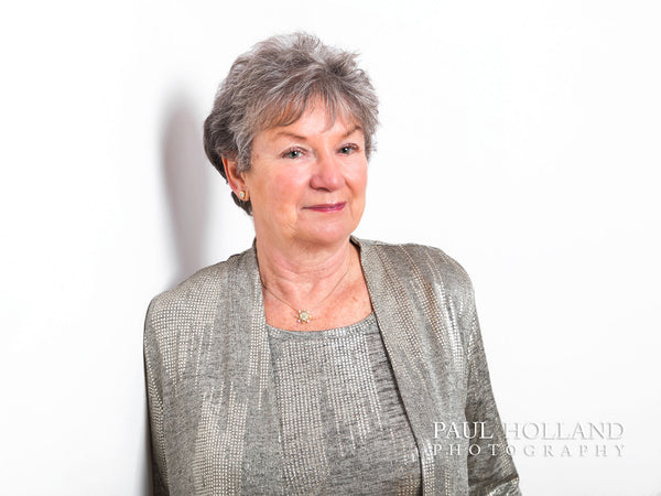 Image shows a woman against a white background