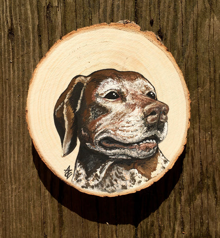 Acrylic painting on wood slice depicting the greying face of an old German Shorthaired Pointer dog. She has brown, grey, and white fur. She is facing towards the right, looking off into the distance.