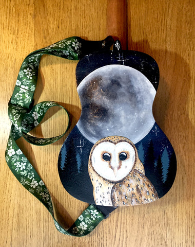 Hand painted ukulele depicting a barn owl perched beneath a full moon.