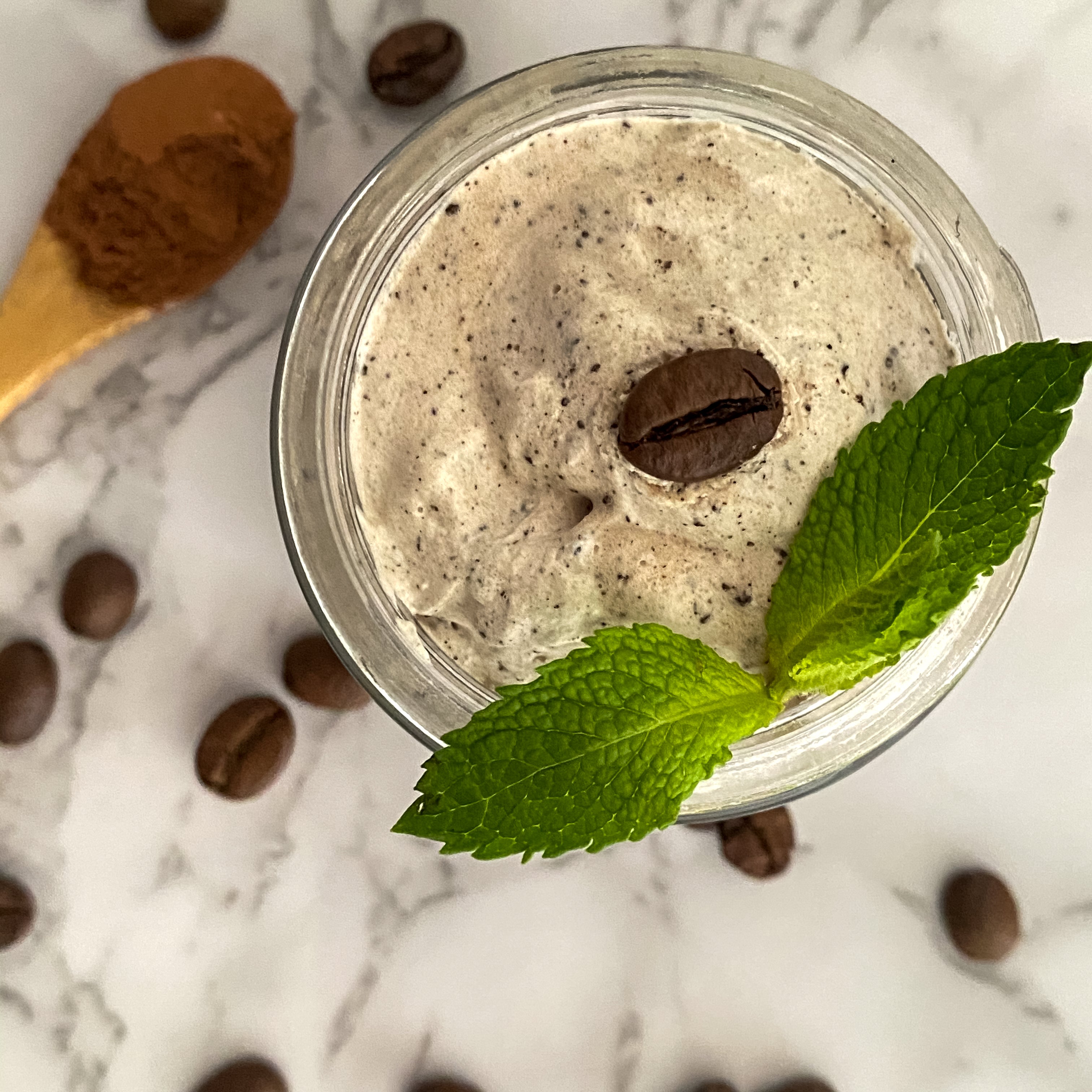 Coffee scrubs in jar with coffee beans