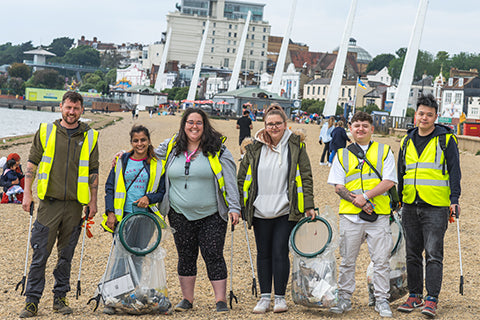 The amazing Riot Labs team cleaning up beach litter for World Oceans Day