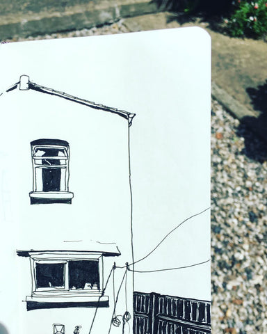 A drawing of the side of a house in full sun with lots of strong shadows