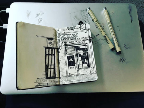 A sketch of Zen Records in an open sketchbook