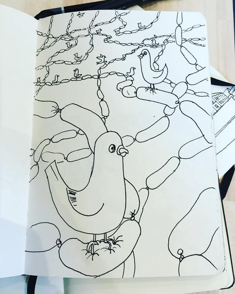 A line drawing of pigeons sitting on sausages