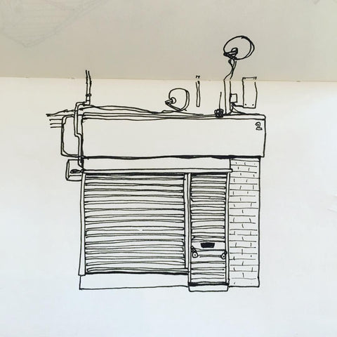 A line drawing of a shop with the shutters down
