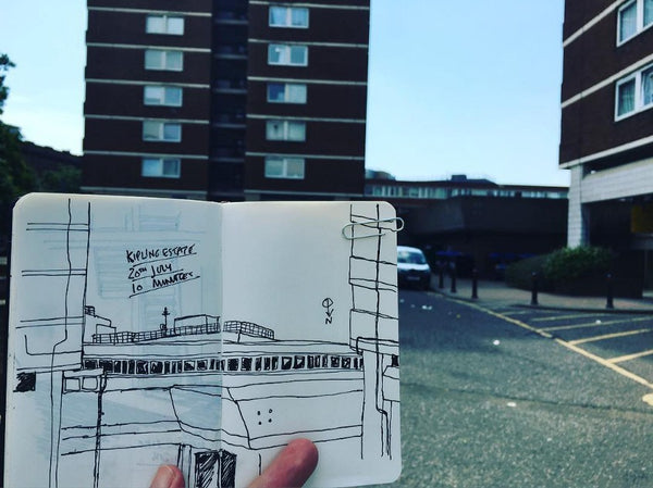 An open sketchbook held up showing a timed sketch in Southend High Street
