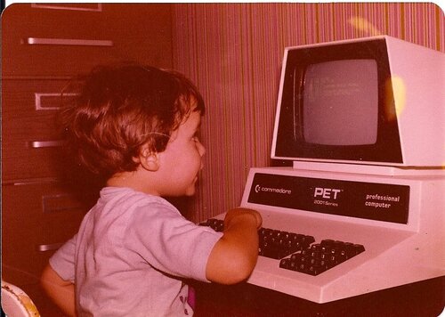 Vintage photo of Stephen as a child playing on a PET commodore 'professional computer'