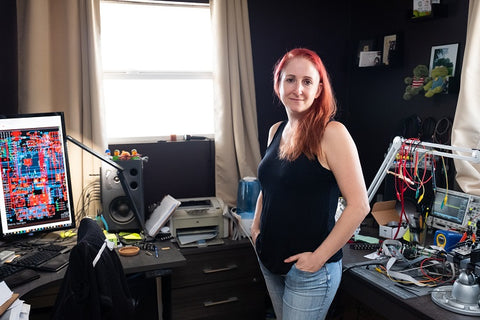 Kris in her office surrounded by equipment