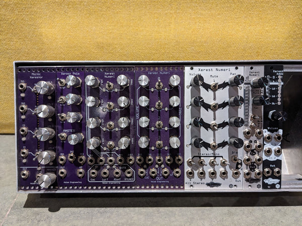 Seven differetn mixer prototypes. Some are purple, others are black and silver. The sizes and features are all very different.